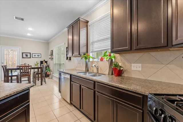 a kitchen with lots of counter top space and dining table