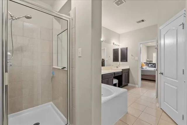 a bathroom with a bathtub and a sink