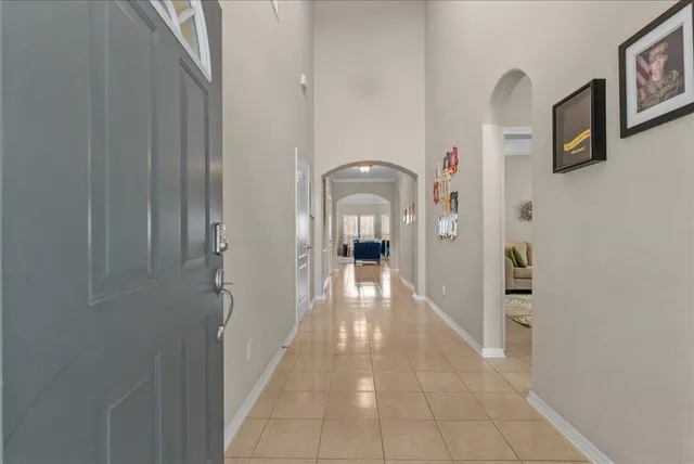 a view of a hallway with paintings on the walls