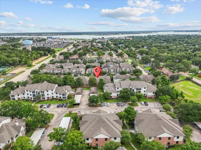 an aerial view of residential houses with outdoor space