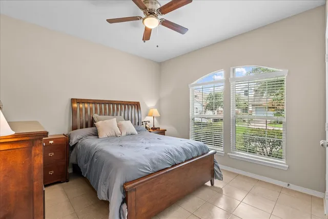 a bedroom with a bed and window