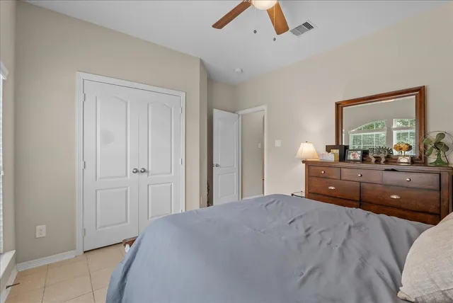 a bedroom with a bed and a dresser