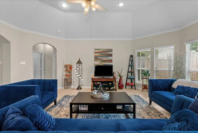 a living room with furniture and a flat screen tv
