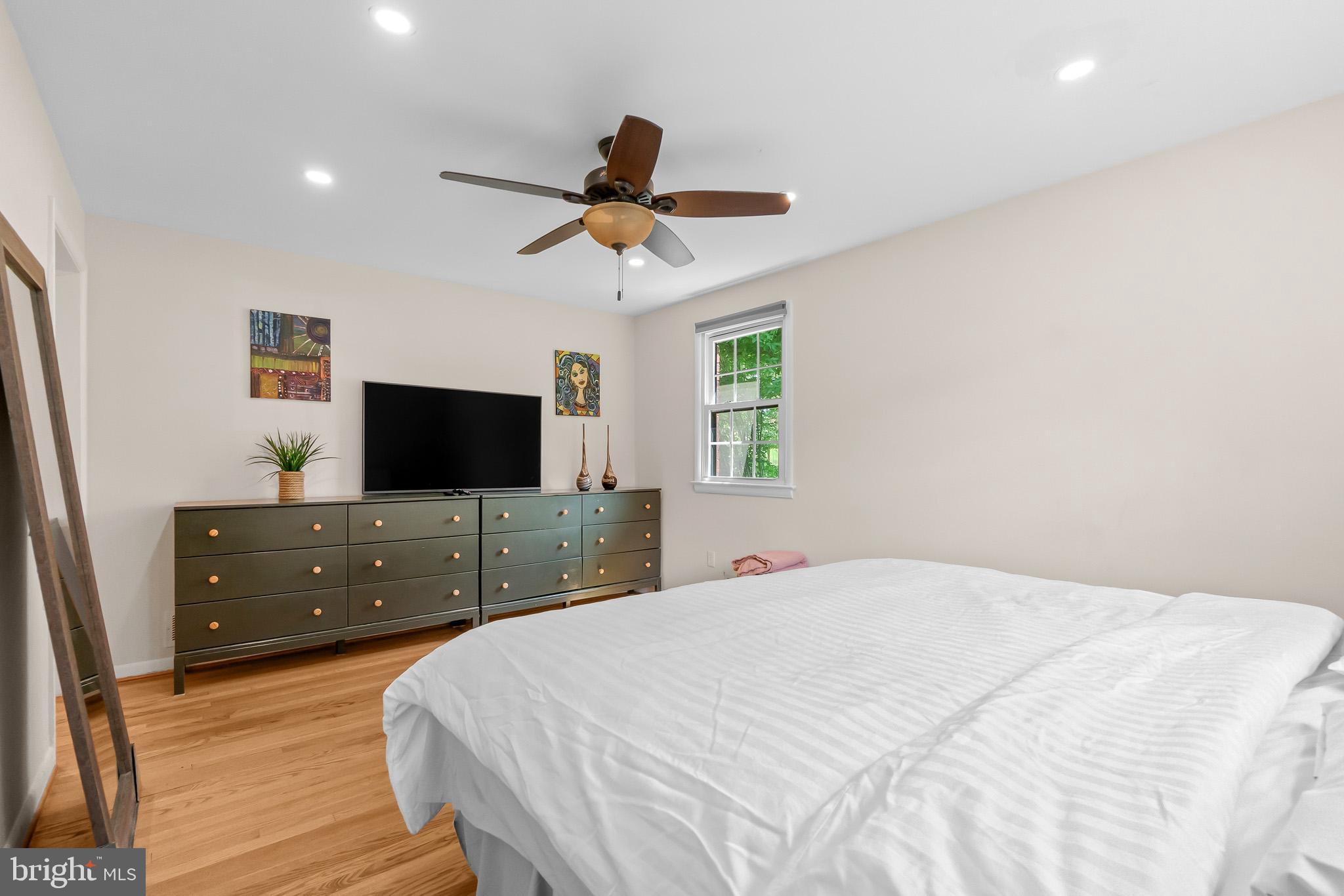 2003 Forest Dale Drive Silver Spring, MD 20903 - Photo 13 of 44 a bedroom with a bed and a flat screen tv