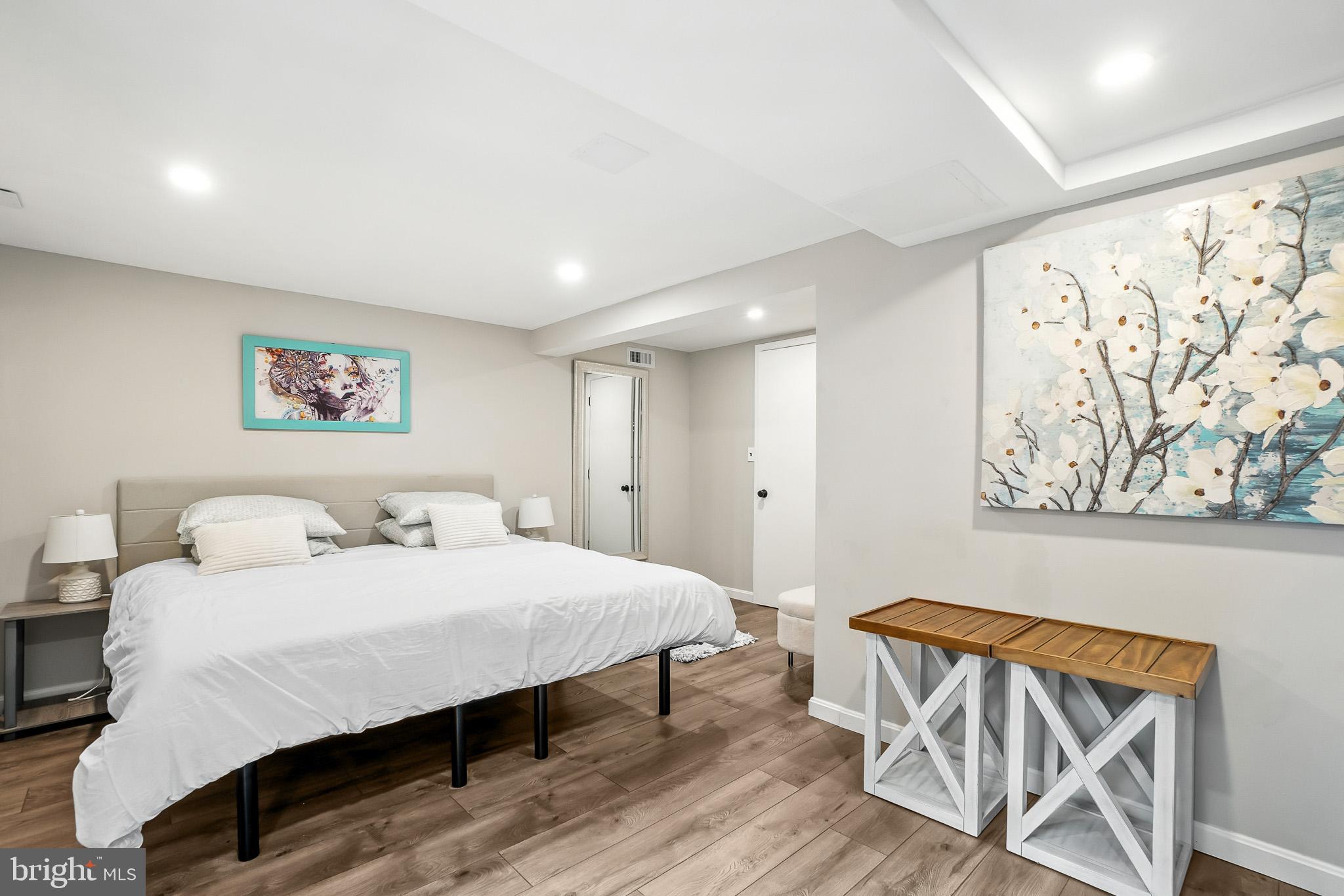 2003 Forest Dale Drive Silver Spring, MD 20903 - Photo 23 of 44 a bedroom with a bed and a painting on the wall