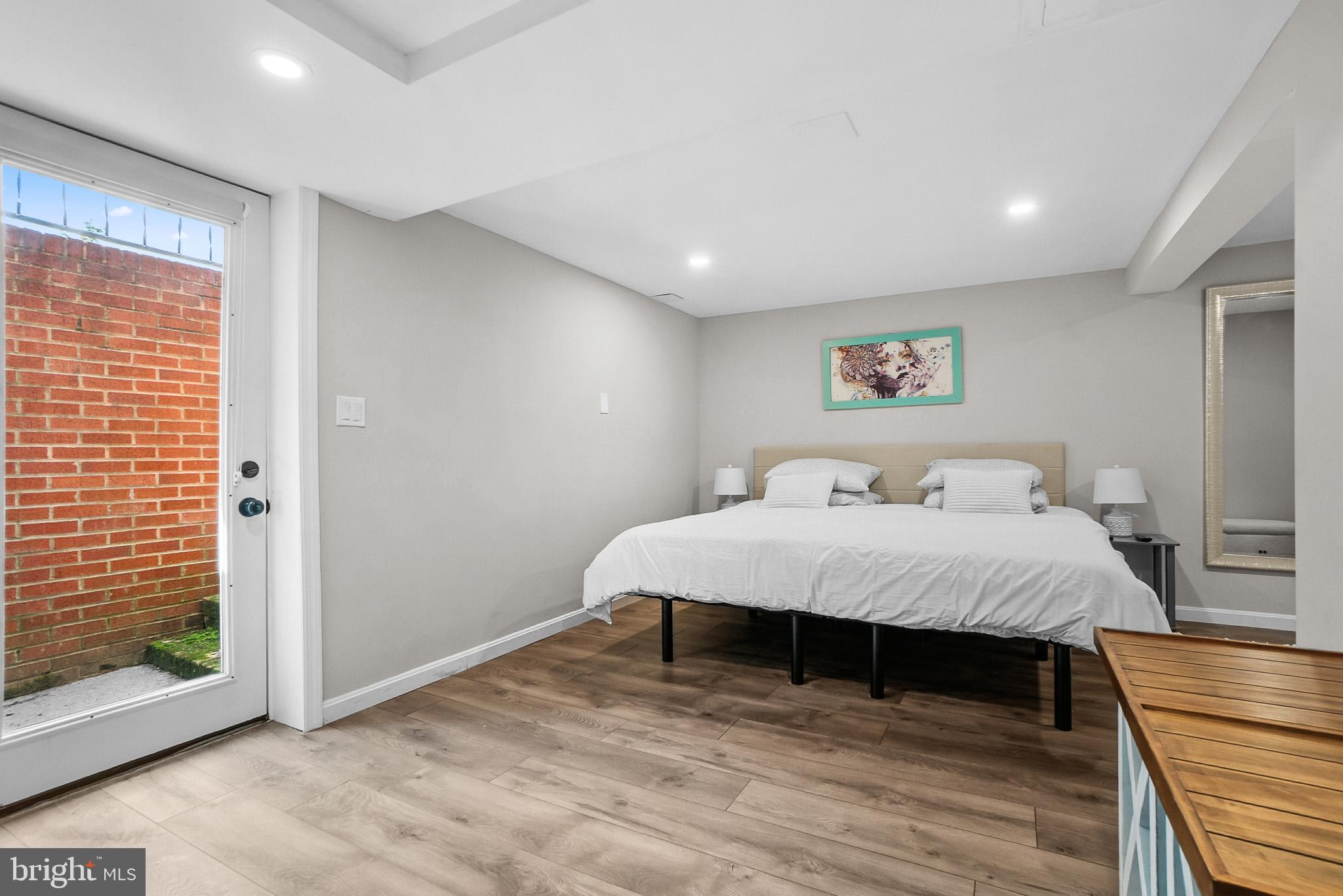 2003 Forest Dale Drive Silver Spring, MD 20903 - Photo 24 of 44 a spacious bedroom with a bed and a table