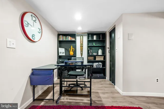 a view of a room with chairs and a table