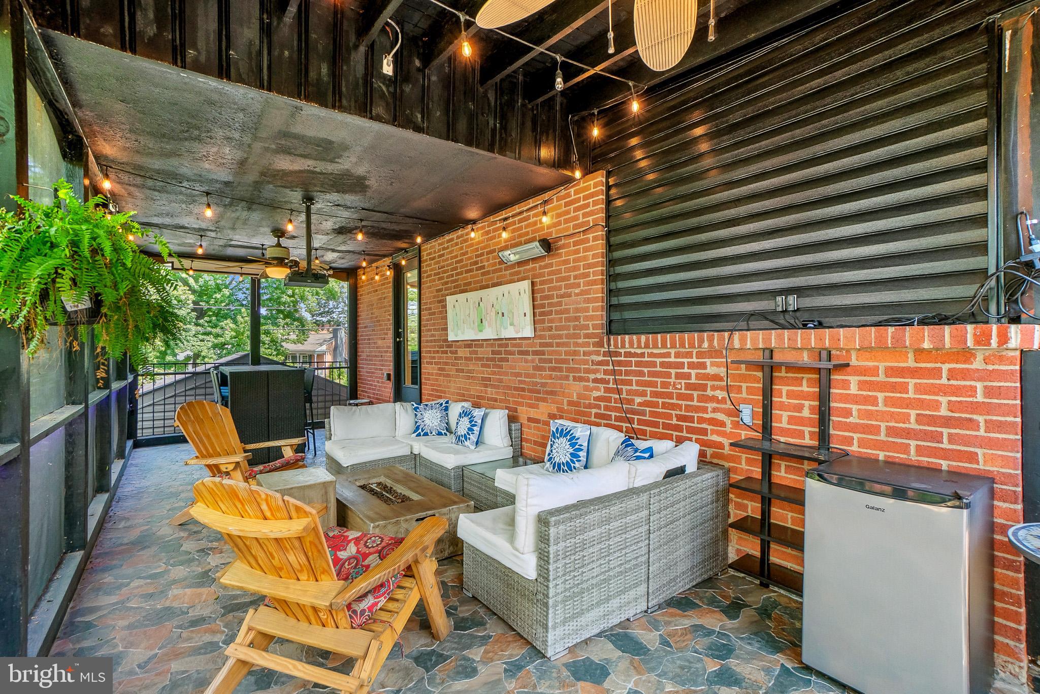 2003 Forest Dale Drive Silver Spring, MD 20903 - Photo 38 of 44 a view of a patio with table and chairs with wooden floor and fence