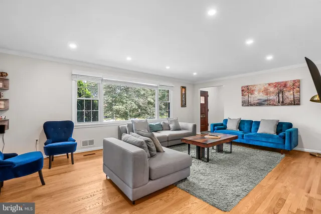 a living room with furniture and a rug