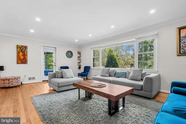 a living room with furniture and a rug