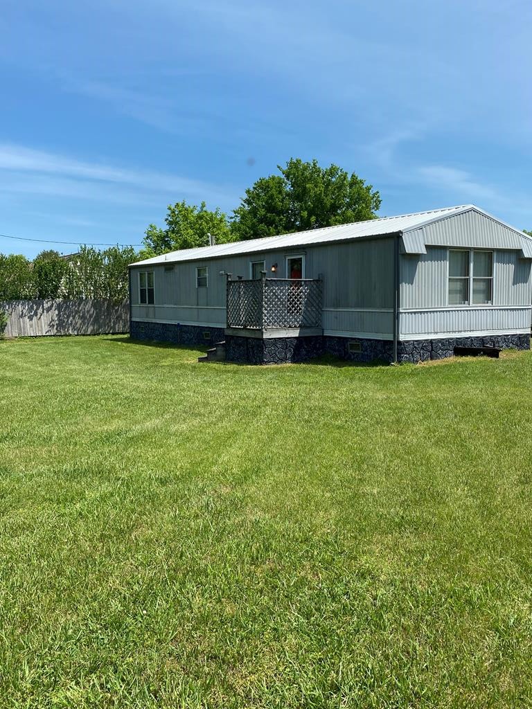 313 Lonesome Pine Road Bybee, TN 37713 - Photo 45 of 48 a backyard of a house with lots of green space