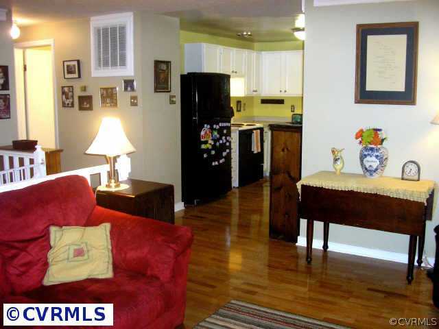 10512 White Rabbit Road Richmond, VA 23235 - Photo 5 of 10 a living room with furniture and a table