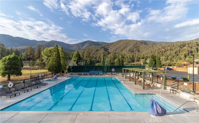 a view of a swimming pool with a lounge chairs