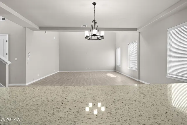 a view of a livingroom with a chandelier fan