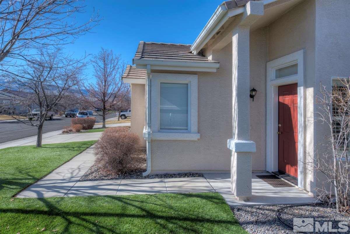 1721 Trek Trail Reno, NV 89521 - Photo 3 of 25 a front view of a house with a yard