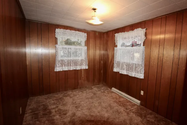 a view of hallway with windows