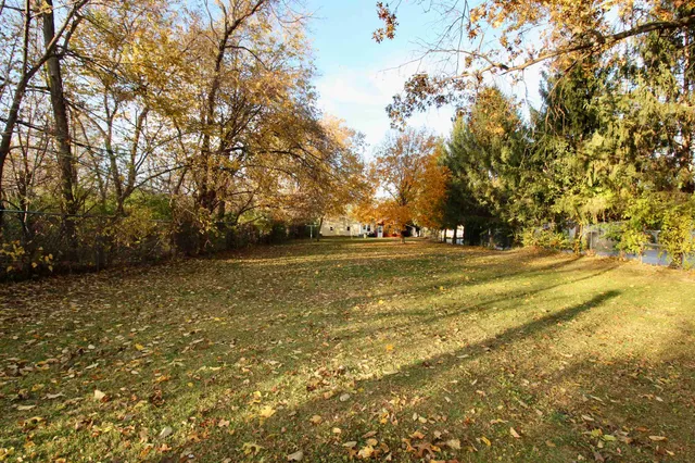 a view of outdoor space with deck and yard