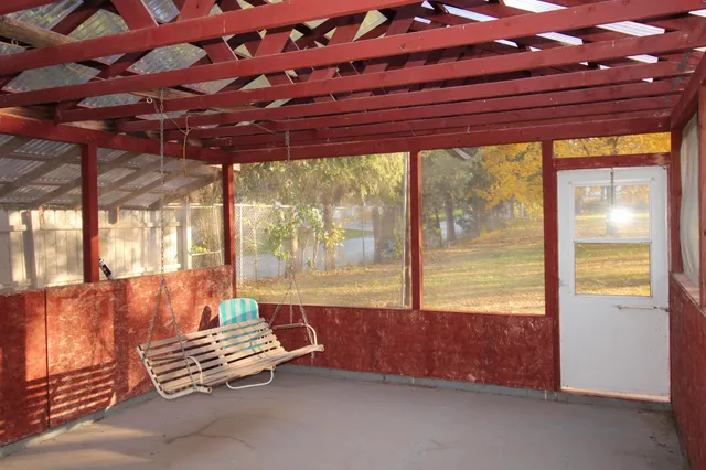 a outdoor space with couch and outdoor view