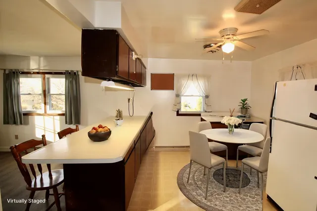 a dining room with furniture and window