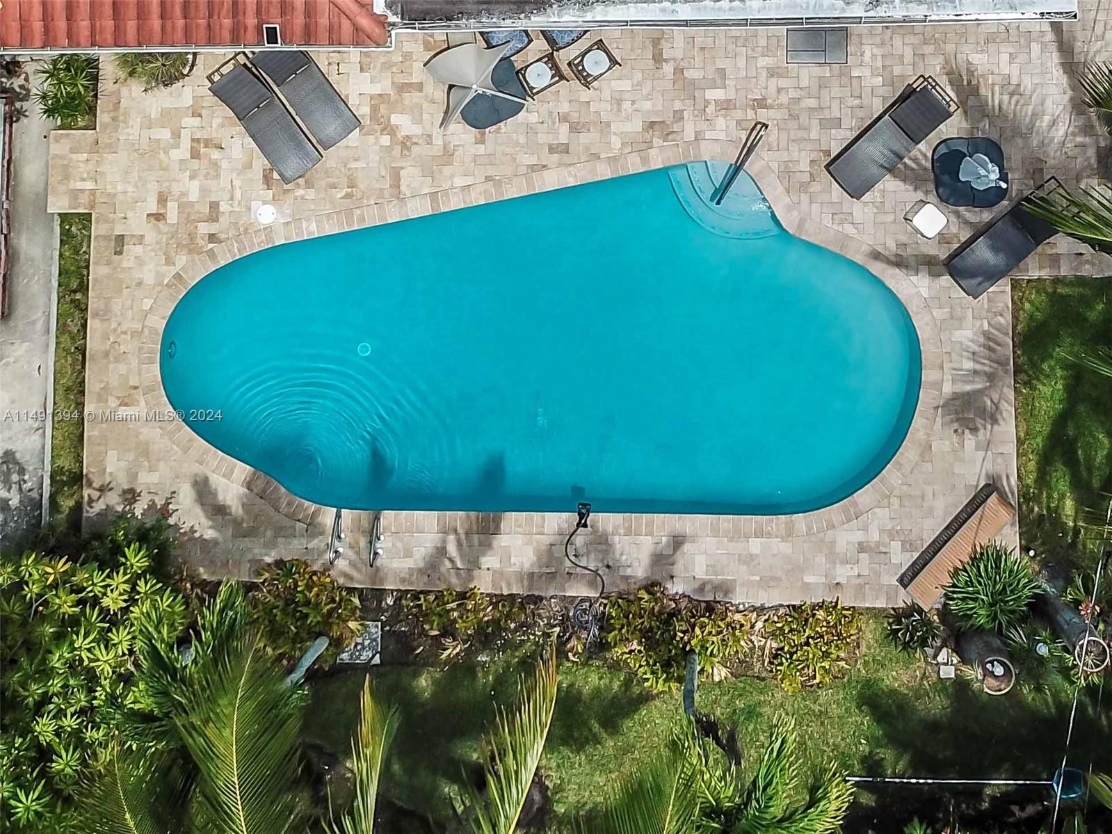 an aerial view of a swimming pool
