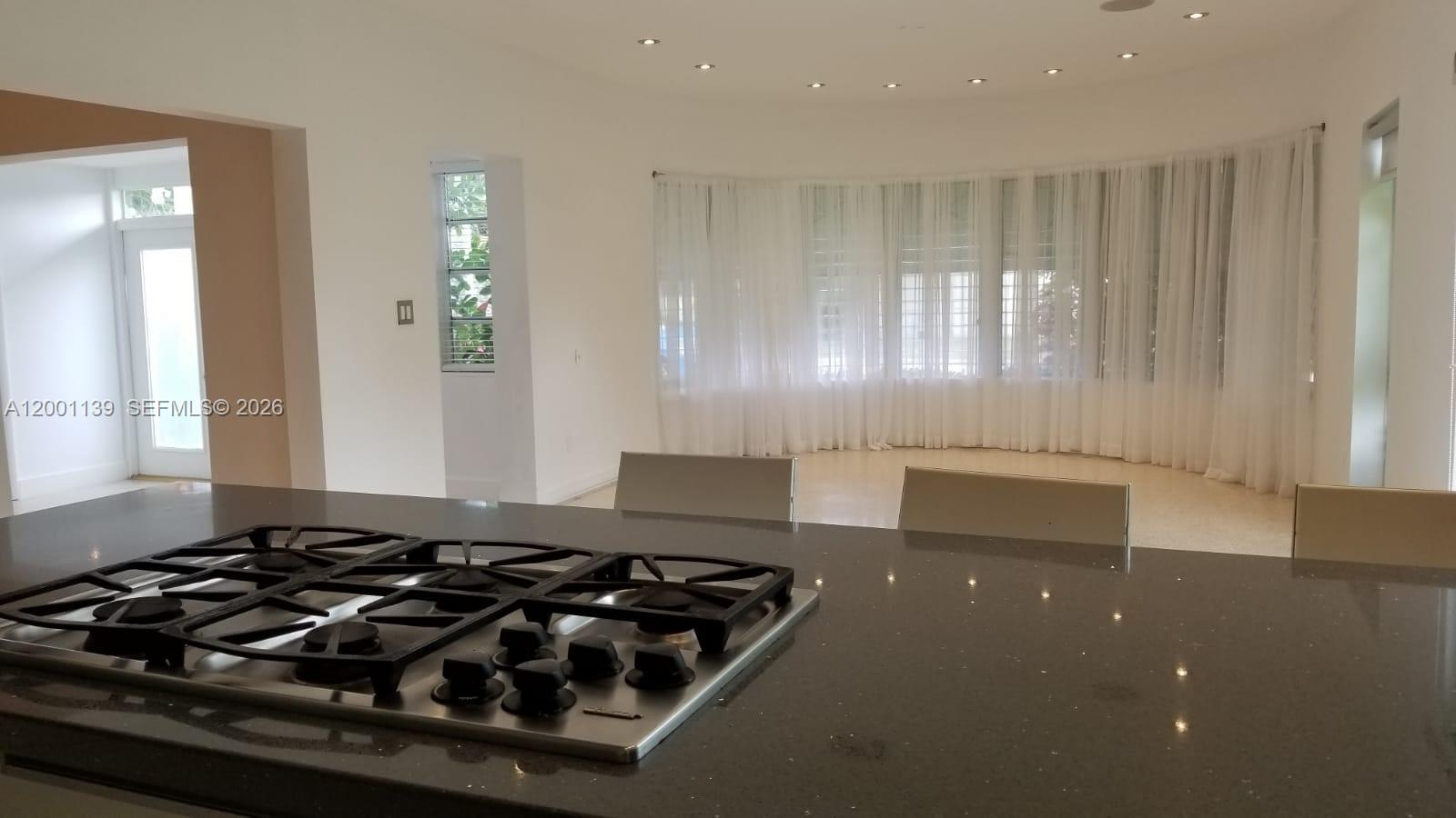 625 93rd Street Surfside, FL 33154 - Photo 12 of 50 a black and white photo of a living room