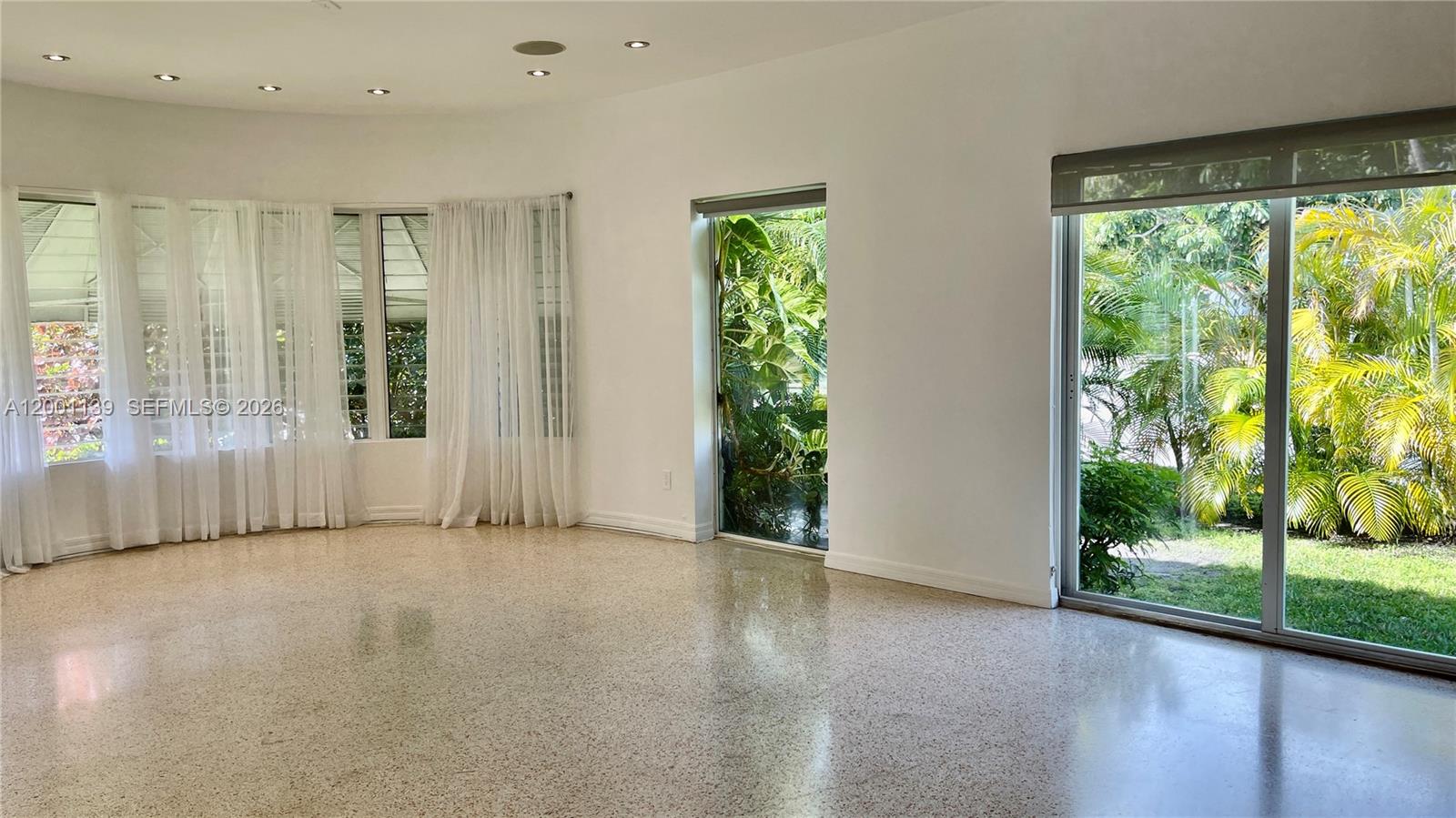 625 93rd Street Surfside, FL 33154 - Photo 16 of 50 a view of a room with large windows and floor to ceiling window