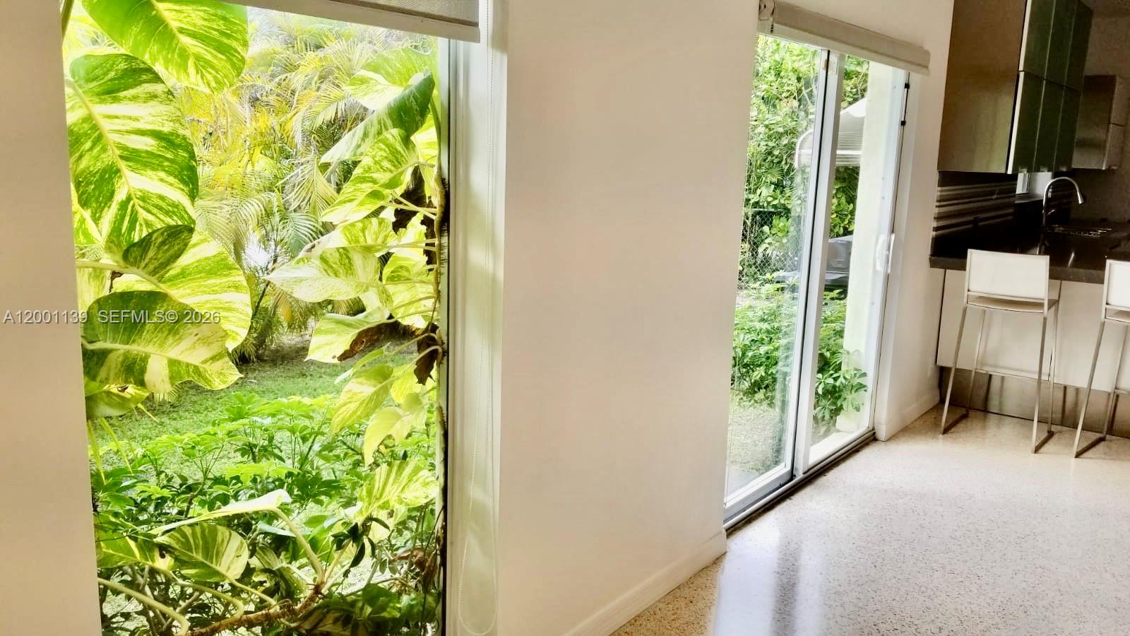 625 93rd Street Surfside, FL 33154 - Photo 19 of 50 a balcony with trees in front of it