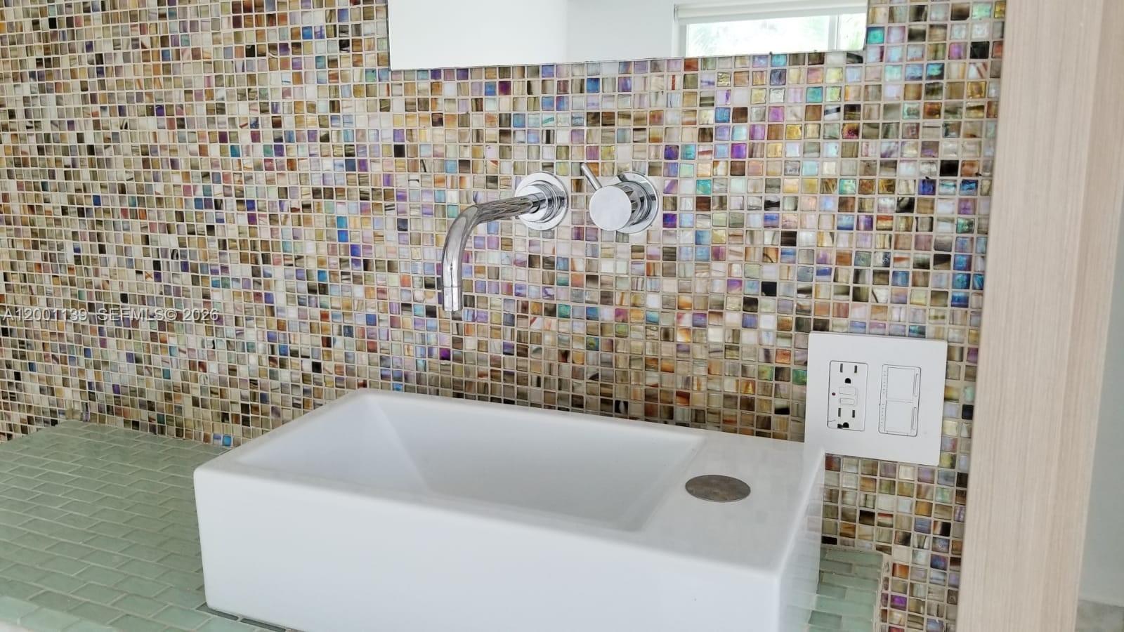 625 93rd Street Surfside, FL 33154 - Photo 24 of 50 a bathroom with a bathtub and shower