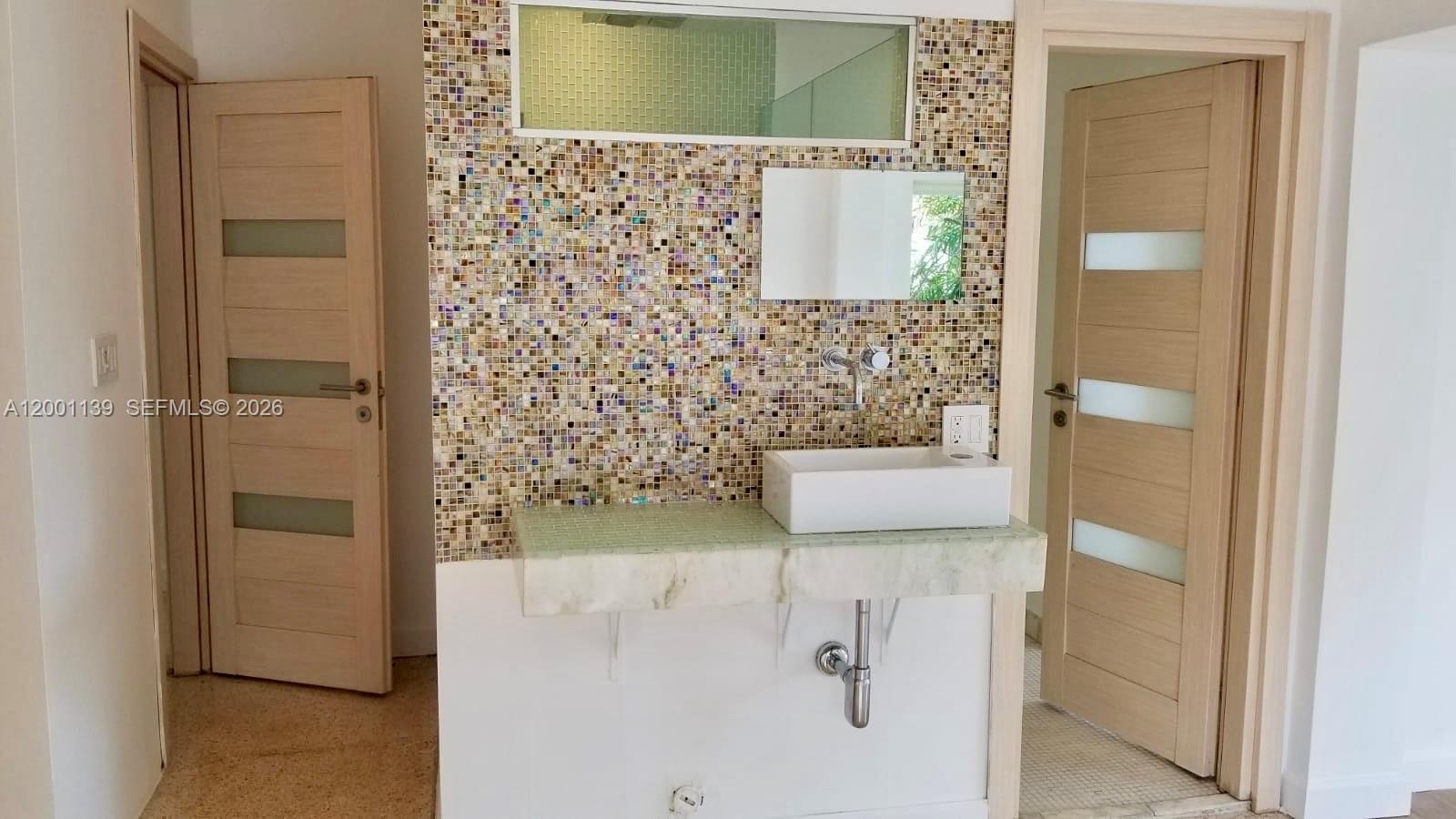 625 93rd Street Surfside, FL 33154 - Photo 25 of 50 a bathroom with a shower