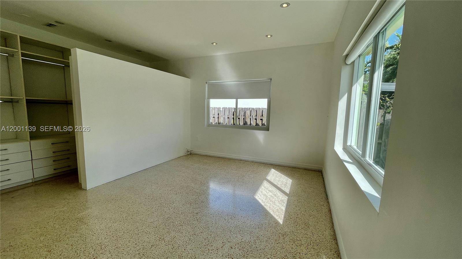 625 93rd Street Surfside, FL 33154 - Photo 35 of 50 an empty room with windows