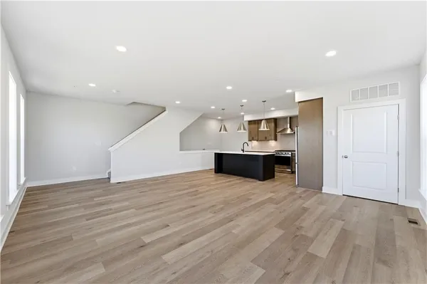 a view of kitchen and kitchen with furniture wooden floor and window