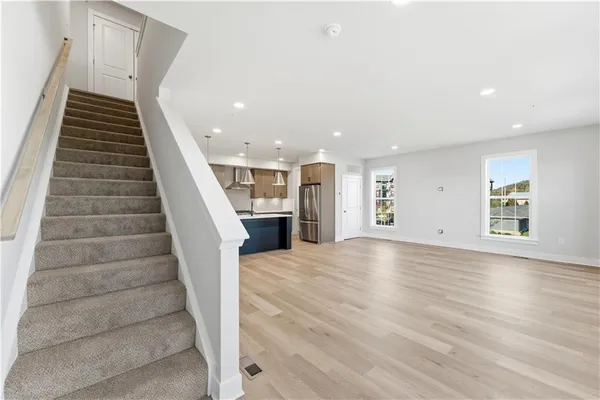 a view of an entryway with wooden floor