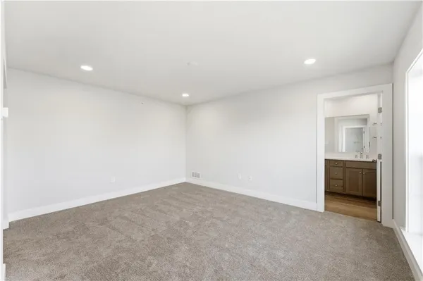 an empty room with a bathroom