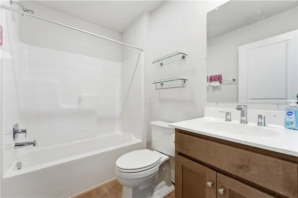 a bathroom with a sink a toilet and a bathtub