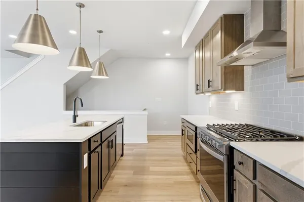 a kitchen that has a sink and a stove