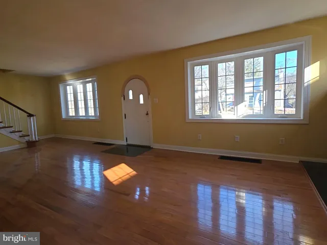 a view of an entryway with wooden floor