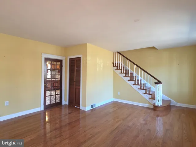 a view of a living room with furniture and a fireplace