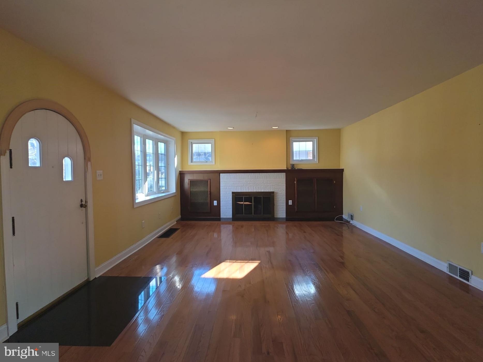 167 Singley Avenue Runnemede, NJ 08078 - Photo 18 of 56 a view of empty room with wooden floor and fireplace