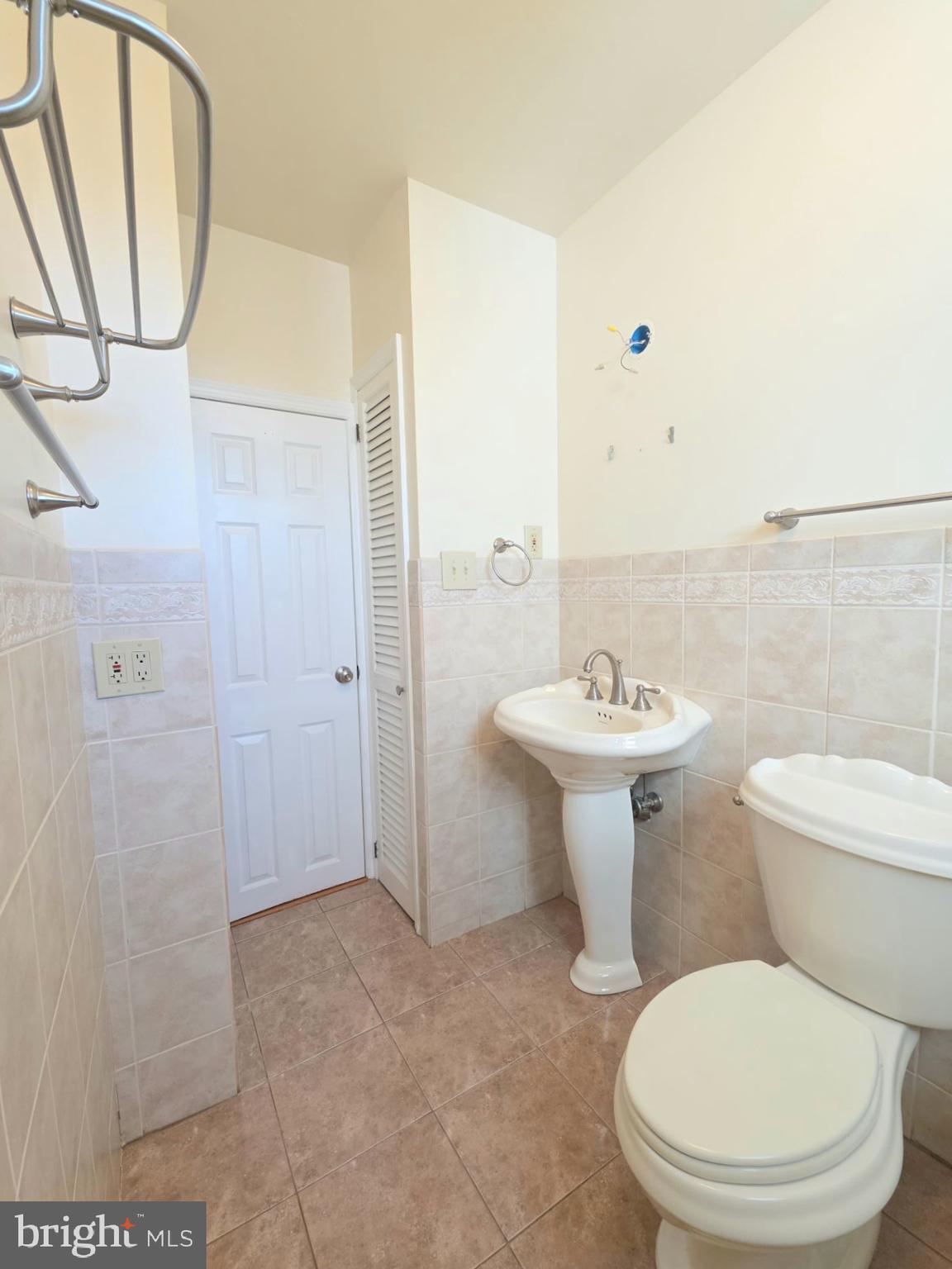 167 Singley Avenue Runnemede, NJ 08078 - Photo 24 of 56 a bathroom with a toilet sink and mirror