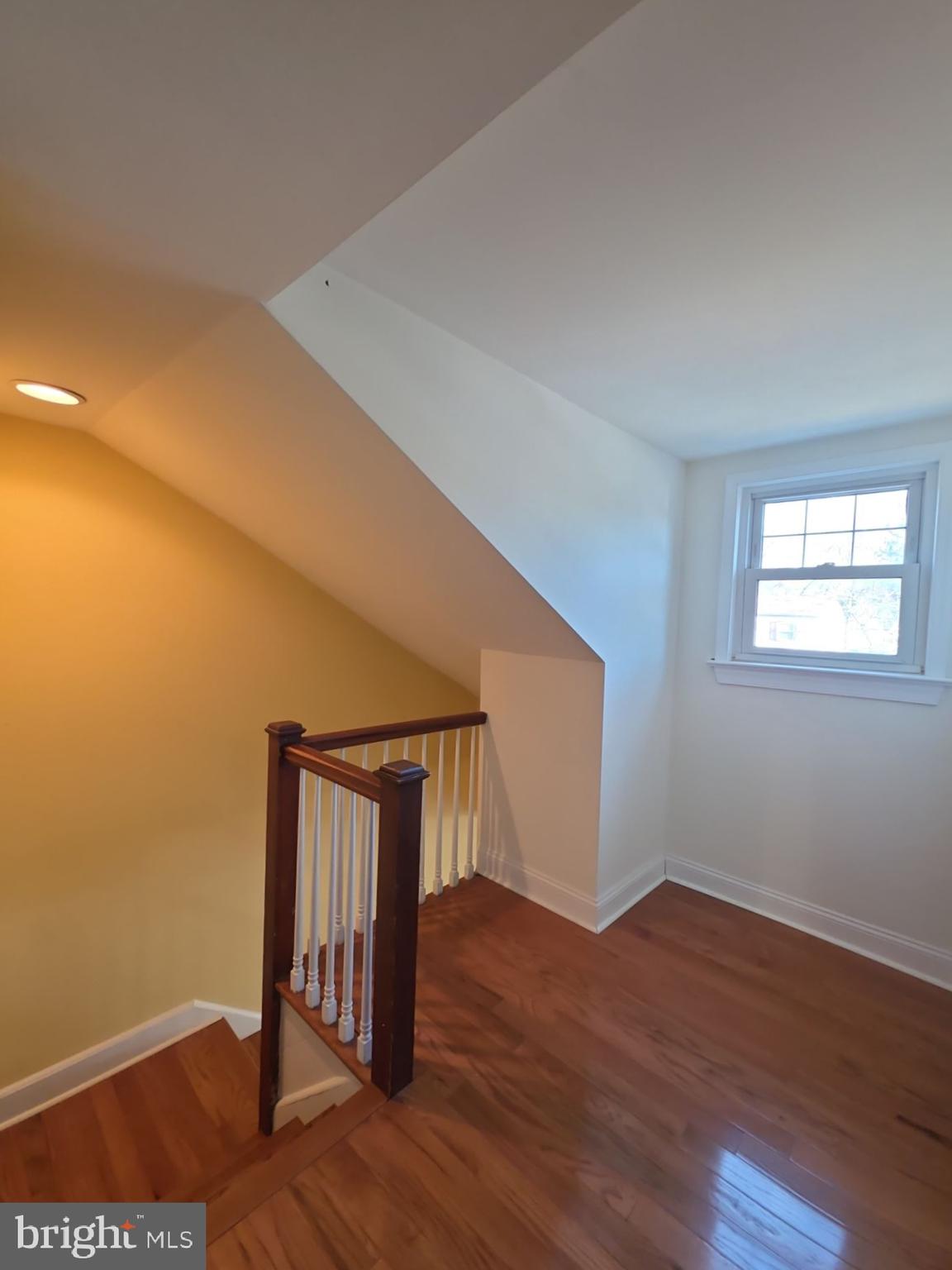 167 Singley Avenue Runnemede, NJ 08078 - Photo 36 of 56 a view of an empty room with wooden floor and a window