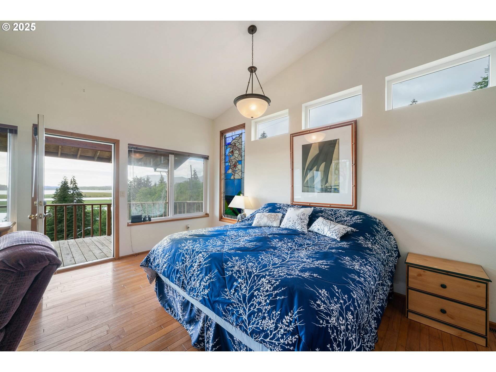 336 Gregory Street Wheeler, OR 97147 - Photo 18 of 42 a bedroom with a large bed and a window