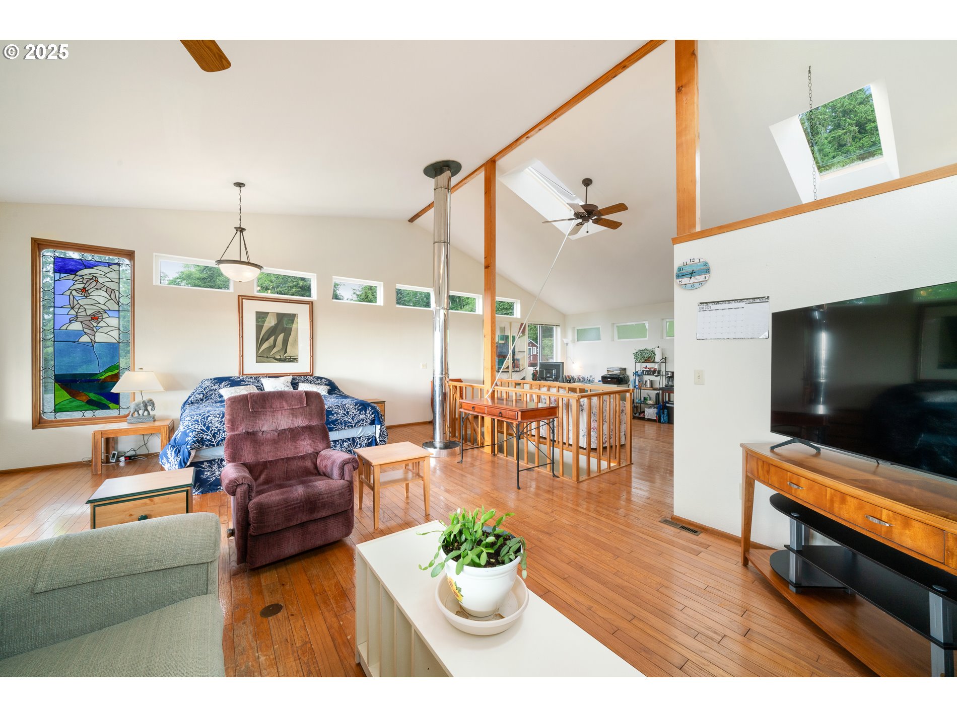 336 Gregory Street Wheeler, OR 97147 - Photo 20 of 42 a living room with furniture and a flat screen tv