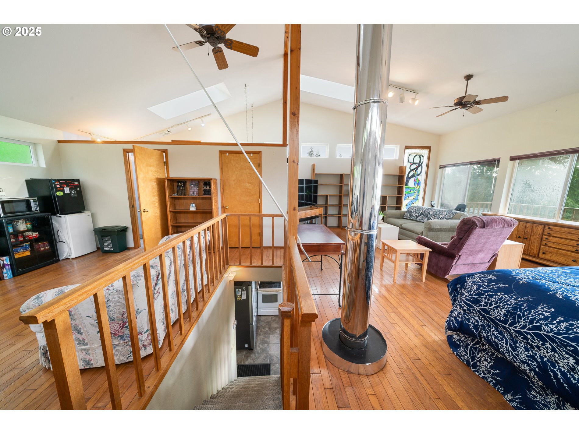 336 Gregory Street Wheeler, OR 97147 - Photo 22 of 42 a living room with furniture a rug and white walls