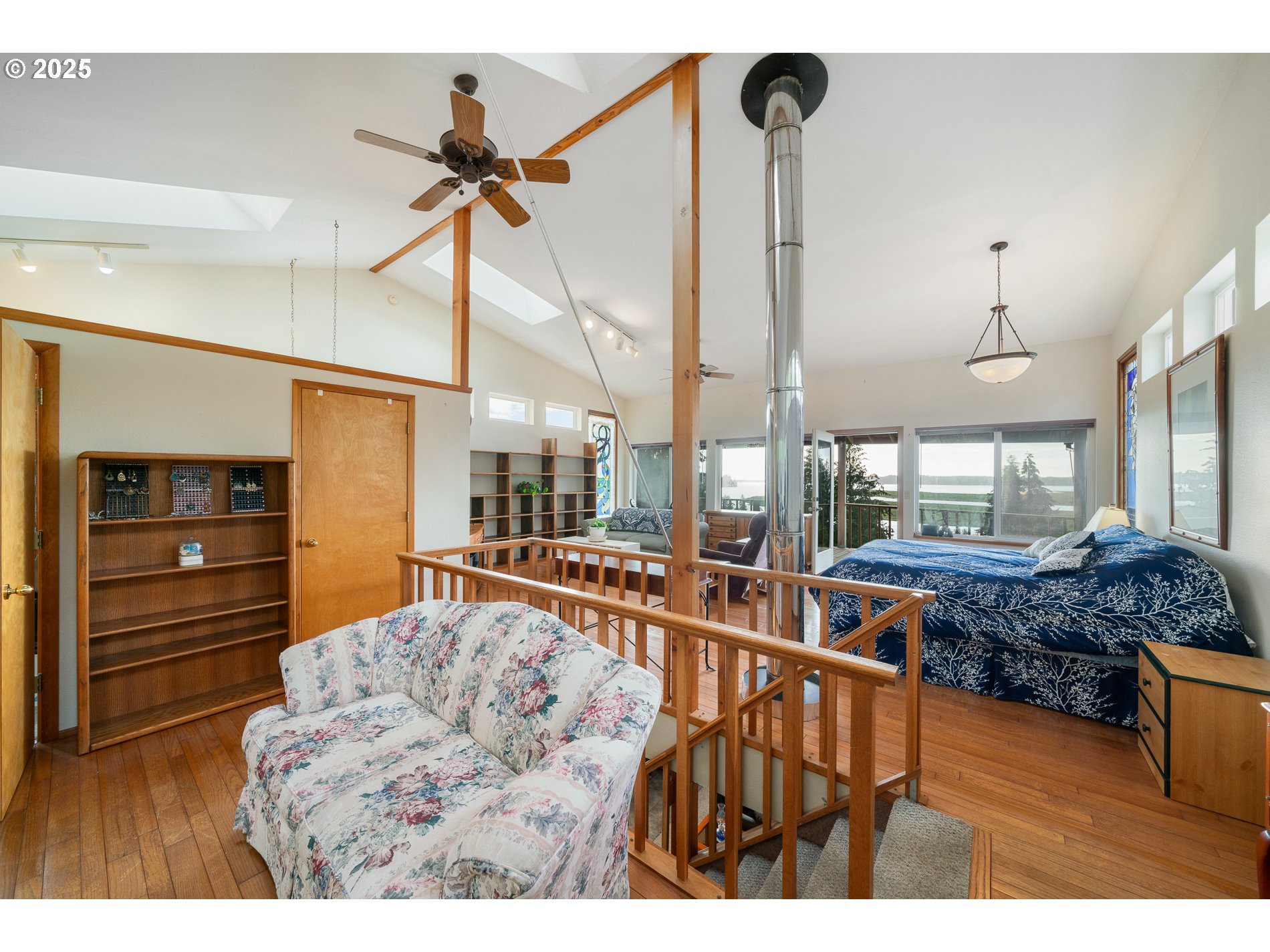 336 Gregory Street Wheeler, OR 97147 - Photo 23 of 42 a living room with furniture and a chandelier
