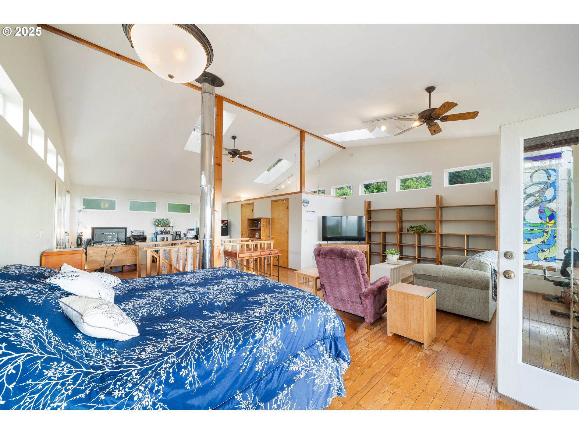 336 Gregory Street Wheeler, OR 97147 - Photo 24 of 42 a living room with furniture fireplace and a large window