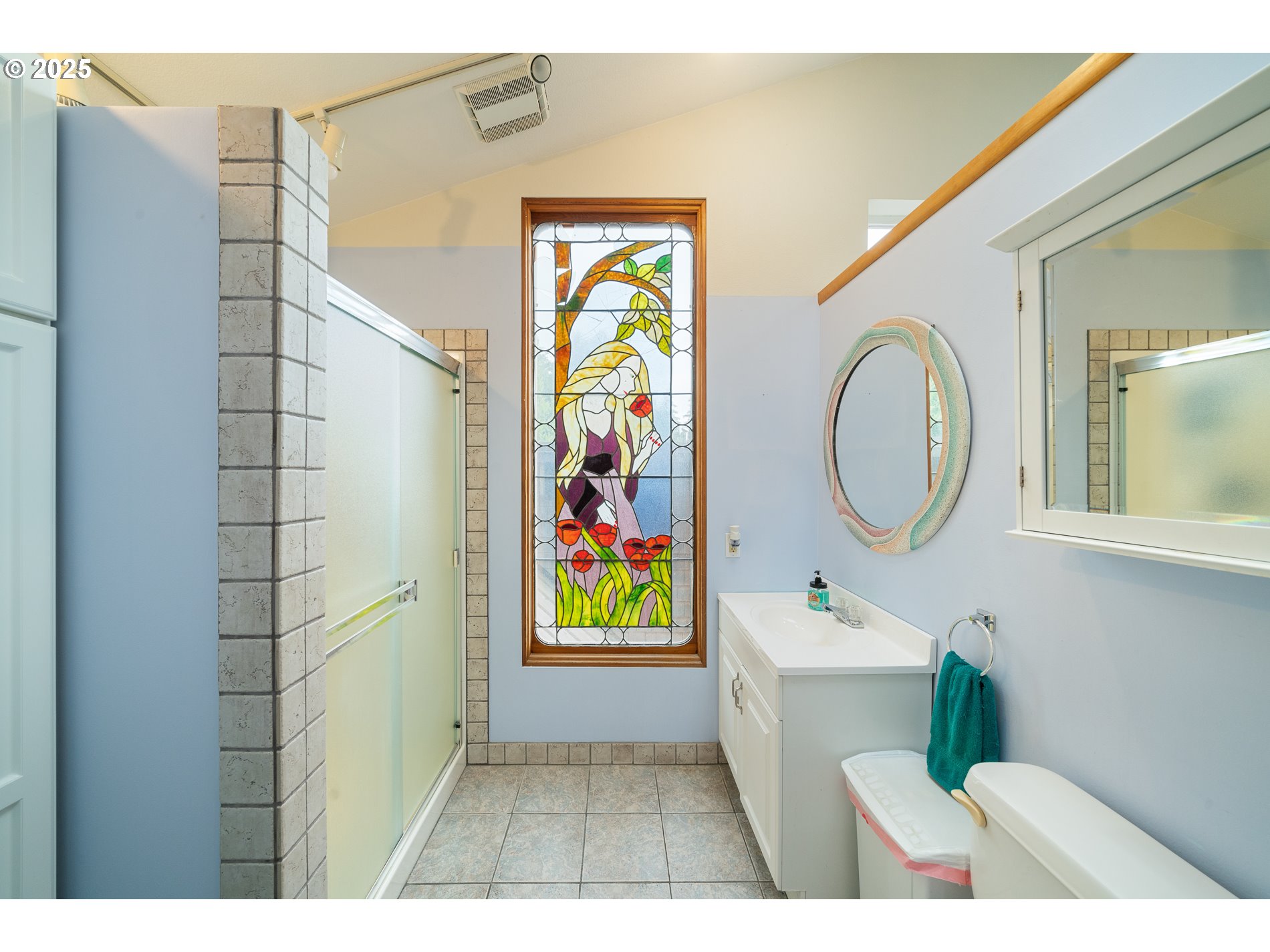 336 Gregory Street Wheeler, OR 97147 - Photo 25 of 42 a bathroom with a sink a toilet and a mirror