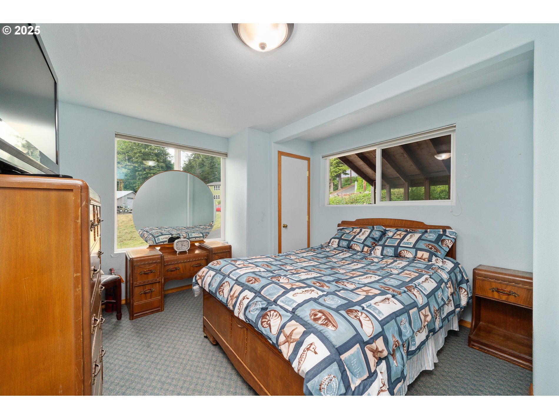 336 Gregory Street Wheeler, OR 97147 - Photo 27 of 42 a bedroom with a bed room window and furniture