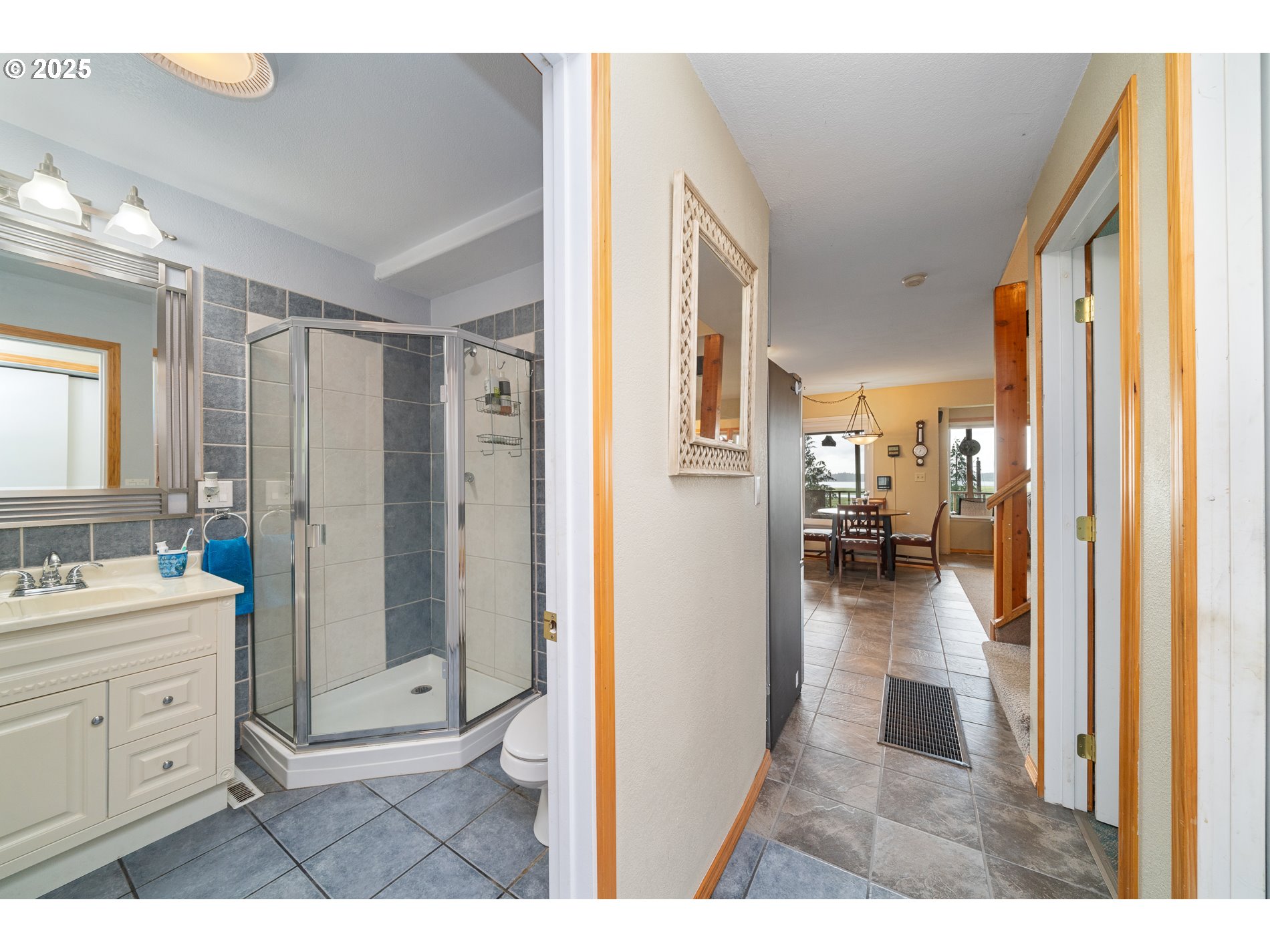 336 Gregory Street Wheeler, OR 97147 - Photo 28 of 42 a bathroom with a sink a mirror a shower and vanity