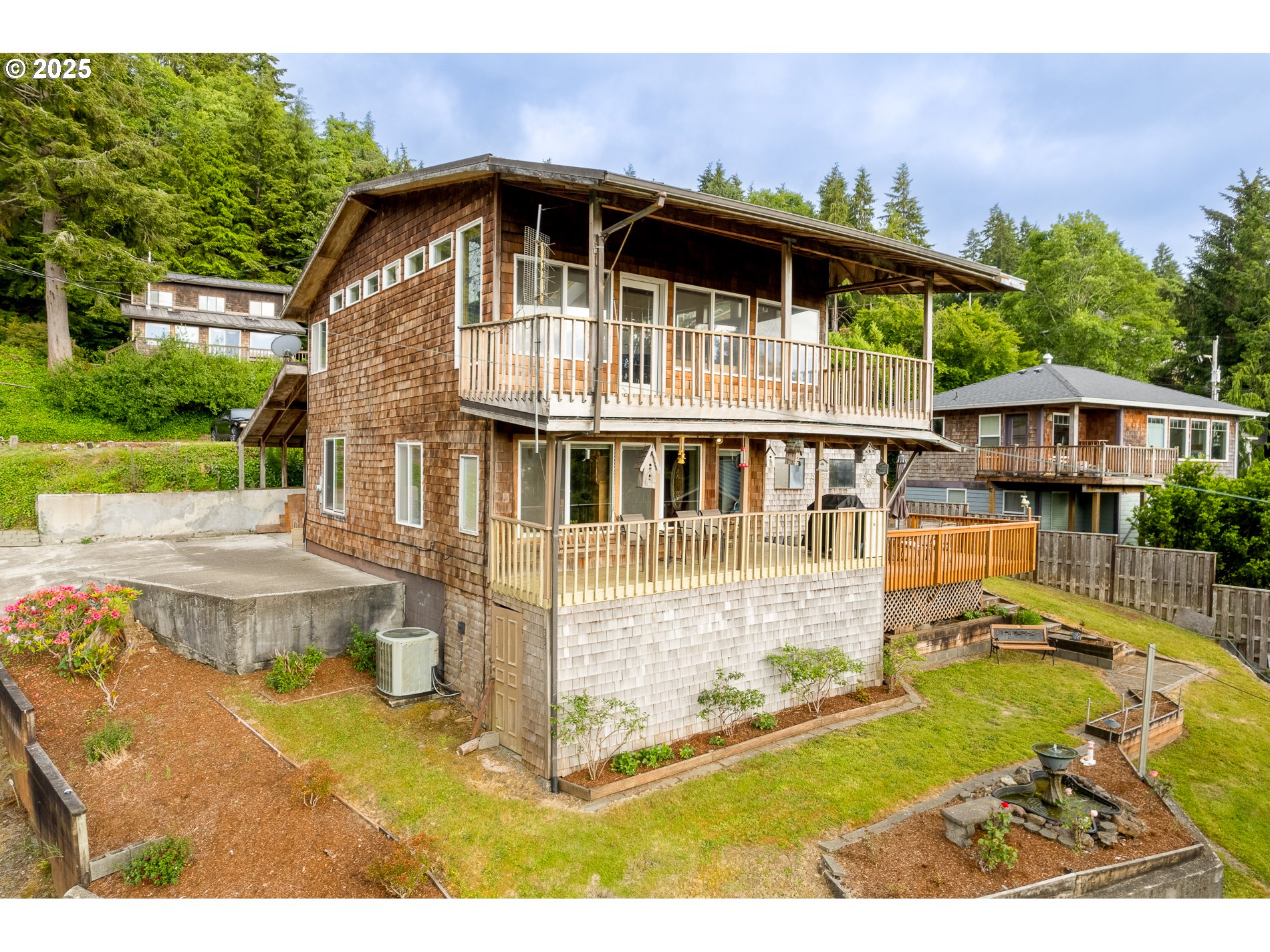 336 Gregory Street Wheeler, OR 97147 - Photo 3 of 42 a front view of a house with a yard
