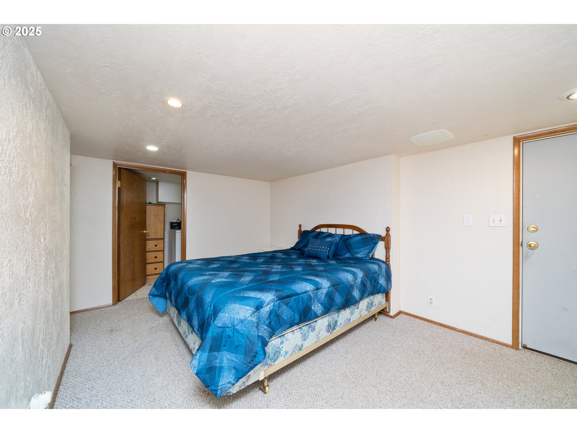 336 Gregory Street Wheeler, OR 97147 - Photo 31 of 42 a bedroom with a bed and a night stand